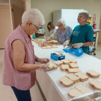 District 2-E2 – Godley Lions Club Brings Community Together with “When We Love Sandwiches” Project