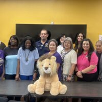 District 2-T3 – A Purse of Her Own